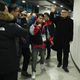 Howard is escorted from the arena by security personnel.